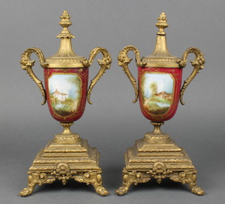 A pair of 19th Century Continental gilt spelter and porcelain twin handled urns 11" 