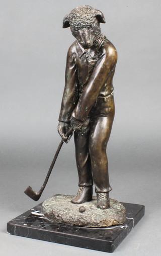 A bronze figure of  a standing golfing sheep, raised on a black marble base 16"h 