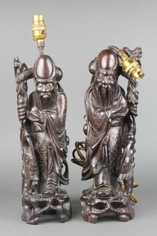 2 Chinese carved hardwood figures of standing sages, converted for use as table lamps 
