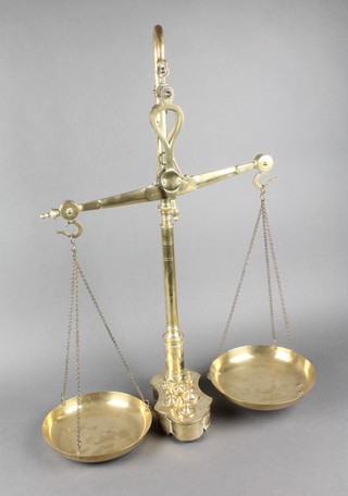 A pair of brass pan scales complete with weights 