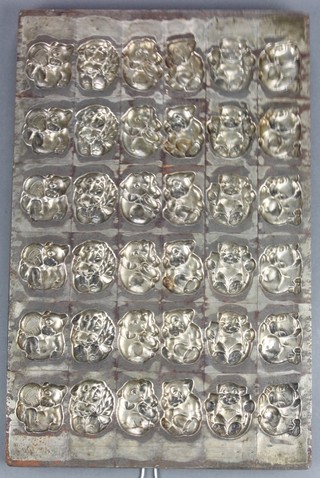 A Dutch 36 division metal chocolate mould decorated dogs 17" x 11"  