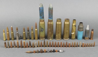 3 cannon shell cases, various bullet heads etc 