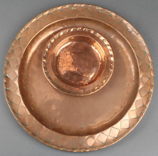 Two Art Nouveau circular copper dishes marked H W and with engraved borders 11" and 5 1/2" 
