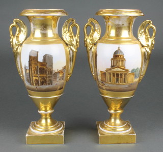 A pair of 19th Century Paris porcelain vases the gilt ground with panels of cathedrals having swan handles 12"