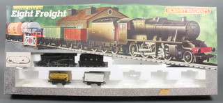 A Hornby electric 8 freight train set comprising locomotive, tender, 2 cargo wagons