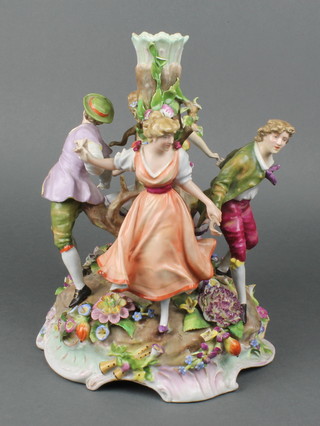 A 19th Century Continental porcelain candelabrum base with 4 figures dancing around a tree the base encrusted with flowers 12"