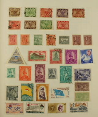 An album of mint and used World stamps including Nepal, Netherlands, Nederland-Antillen, Nederland-Indies