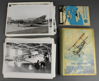 A collection of 1960's and 70's black and white photograph of military and civil aircraft together with a "Book of Aircraft for Boys and Girls 1919", one volume "ABC Civil Aircraft Markings" 