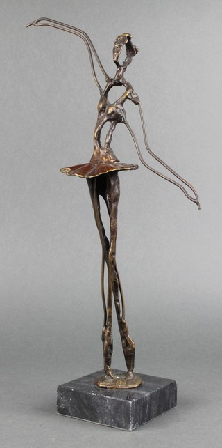 A bronze sculpture of a standing ballerina on a black marble base 15"h 