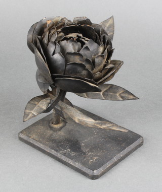 An iron sculpture in the form of a flower head marked AA 5" 