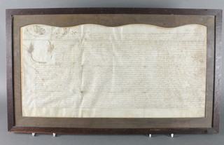 An 18th Century Indenture/lease 13 1/2" x 27" contained in a oak frame 
