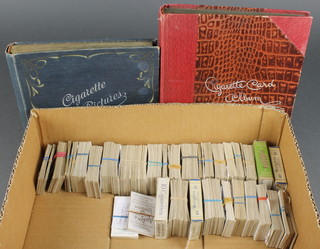 A quantity of various cigarette cards and 2 empty cigarette card albums