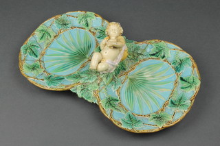 A Victorian Majolica George Jones 2 section dish, the centre handle in the form of a reclining cherub 14"