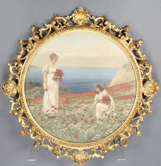 A pair of fancy rococo circular frames with shell crests, 24" containing prints of ladies