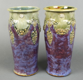 A pair of Royal Doulton oviform vases the purple/green ground decorated with scrolling fruits 8439 12"