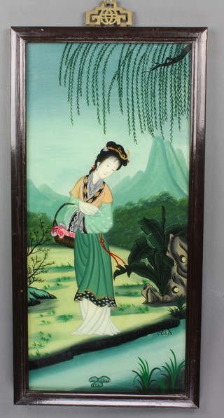 A 20th Century Chinese reverse painting on glass of a lady in a landscape with distant mountains, contained in a hardwood frame and pierced brass hook 25" x 12"