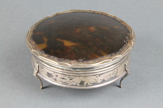 A silver circular trinket box with tortoiseshell lid on scroll feet Birmingham 1918 5"