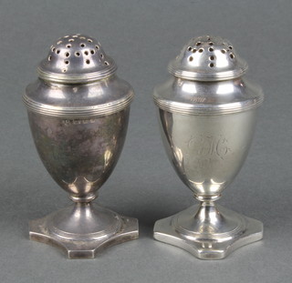 A matched pair of silver urn peppers London 1796 and 1938, 132gr