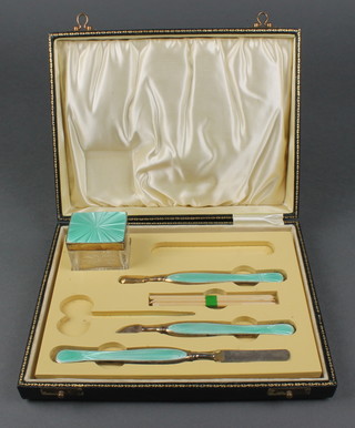 A silver and pale green guilloche enamel manicure set comprising lidded box 2" and three tools Birmingham 1932 