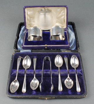 A silver mounted glass match striker Birmingham 1912 2 3/4", a cased set of tea spoons and nips and a cased pair of napkin rings