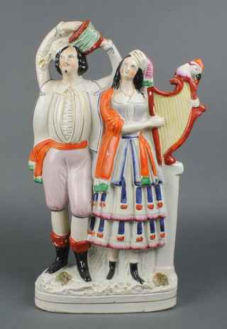 A Victorian Staffordshire group of a concertina and harp player 17"