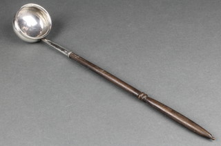 A George III silver toddy ladle with turned fruitwood handle, rubbed marks
