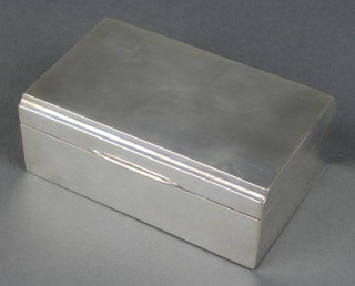 An Art Deco silver cigarette box with engine turned decoration Sheffield 1937 5 1/2"