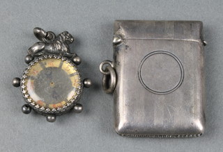 A silver vesta Birmingham 1912 and a silver compass fob