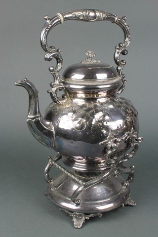 An Edwardian silver plated repousse tea kettle on stand with burner