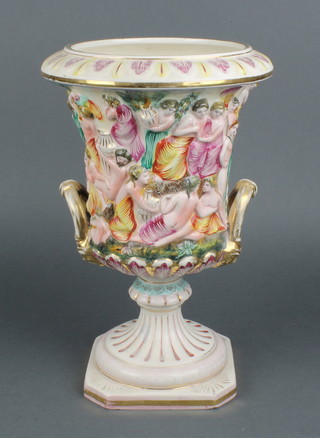 A mid 20th Century Capodimonte 2 handled urn decorated with semi clad revellers 14"