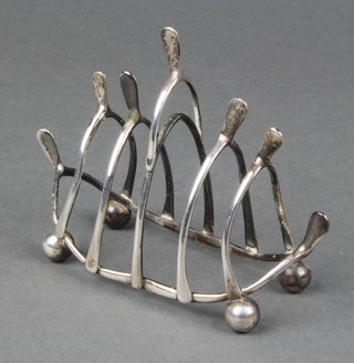 A novelty silver wishbone 4 division toast rack, Chester 1913, 78gr 
