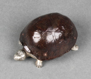 A Victorian style novelty vesta in the form of a tortoise with a tortoiseshell lid and silver base bearing a hall mark London 1882 