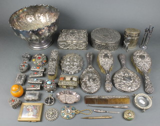 A plated repousse rose bowl, a silver backed brush set and minor items