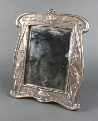 A good Art Nouveau repousse silver dressing table mirror, decorated with king fishers among lilies and lily pads, Indistinct date letter 12" x 10"