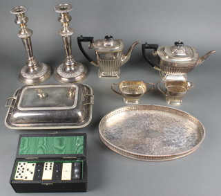 A plated entree set minor plated items and a set of dominoes 
