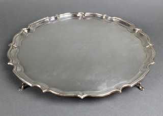 A silver salver with pie crust rim on pad feet with inscription Chester 1926 1200gr 15"