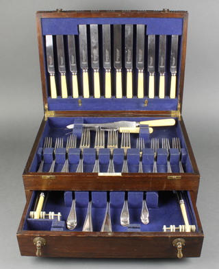 A matched Victorian silver canteen of beaded cutlery comprising 8 dessert and 8 dinner forks, 6 tea, 8 dessert and 4 table spoons with 18 knives and a carving pair in an oak case London 1867/70 2088gr 