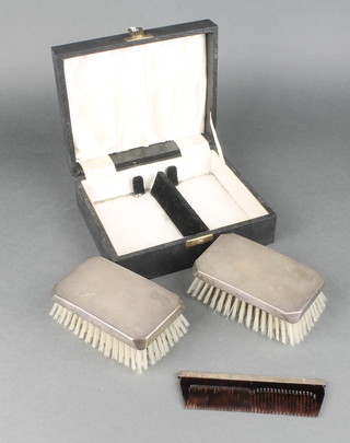 A pair of cased silver backed hair brushes and comb Birmingham 1963