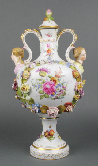 A 20th Century German porcelain 2 handled vase with  panels of classical figures and flowers, with scroll handles and figural terminals with applied flowers 18"