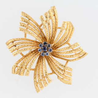 A 1970's 18ct yellow gold spray brooch set with sapphires 