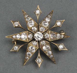 A Victorian gold star shaped brooch, set 32 brilliant cut diamonds 