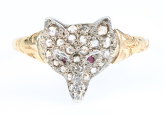 A novelty Edwardian style yellow gold diamond and ruby set fox head ring, size Q 1/2
