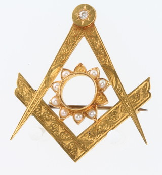 An 18ct yellow gold diamond and seed pearl set Masonic brooch 4.5 grams