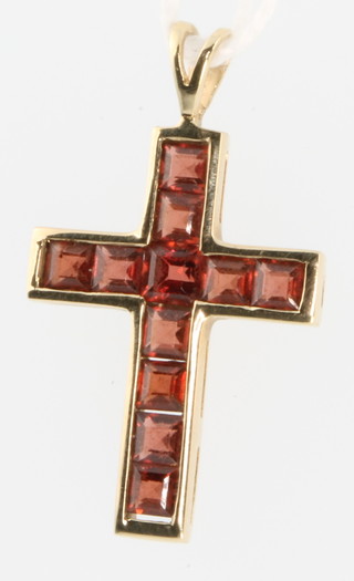 A 9ct gold gem set cross 