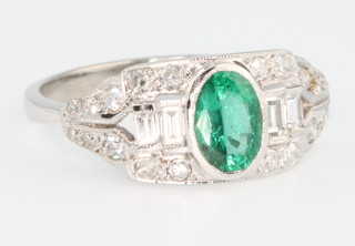 An 18ct white gold emerald and diamond Art Deco style ring, size P