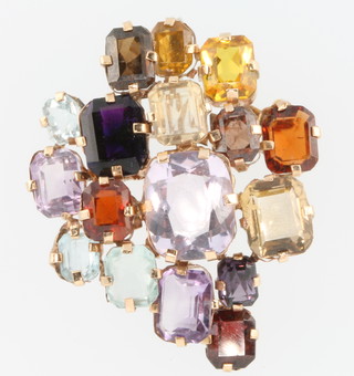 A 1970's yellow gold freeform brooch set with semi-precious stones