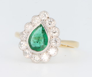 An 18ct yellow gold pear shaped emerald and diamond cluster ring, size O