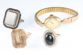 A 9ct yellow gold smoky quartz set dress ring size O, 2 other rings and a wristwatch, together with an unmounted diamond 