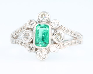 An 18ct white gold emerald and diamond Edwardian style ring, size M