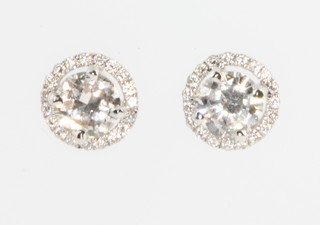 A pair of 18ct white gold single stone diamond ear studs, approx 0.42 and 0.45ct 